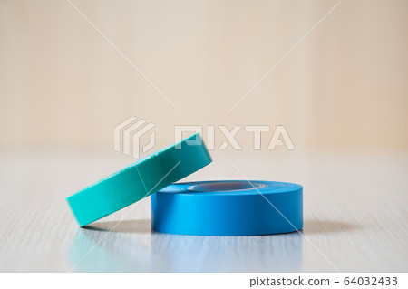 Blue and green insulating tapes to insulate twisted of electrical wires. Blue and green insulating tapes to insulate twisted of electrical wires. 64032433