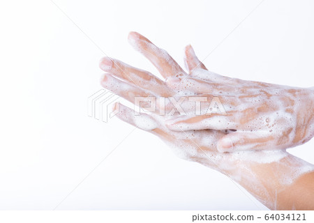 Closeup woman washing hands with soap on white 64034121