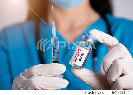 Female doctor with a stethoscope on shoulder 64034365