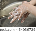 Women's hands washing hands 64036729