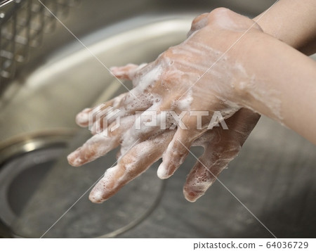 Women's hands washing hands Women's hands washing hands 64036729