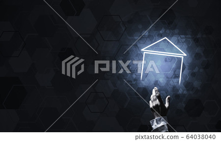 Conceptual image with hand pointing at house or main page icon o Conceptual image with hand pointing at house or main page icon o 64038040