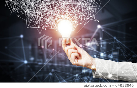 Woman hand with glowing lamp and abstract network Woman hand with glowing lamp and abstract network 64038046