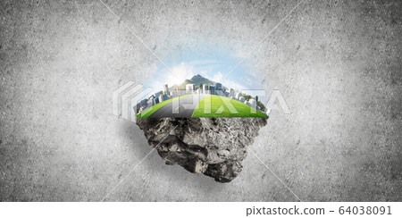 Modern cityscape with towers and skyscrapers on green part of land 64038091