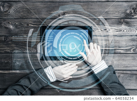 Business workplace with tablet device on wooden surface and medi Business workplace with tablet device on wooden surface and medi 64038234