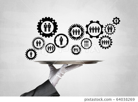 Waiter hand with white gloves holding silver plate full of social media communication icons 64038269