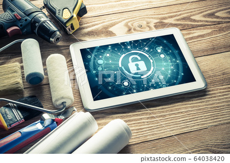 Web security and technology concept with tablet pc on wooden tab Web security and technology concept with tablet pc on wooden tab 64038420
