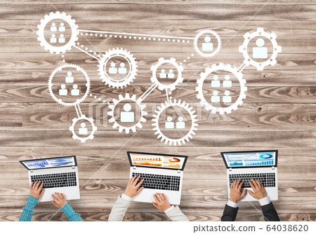 Top view of businesspeople sitting at table and using gadgets Top view of businesspeople sitting at table and using gadgets 64038620