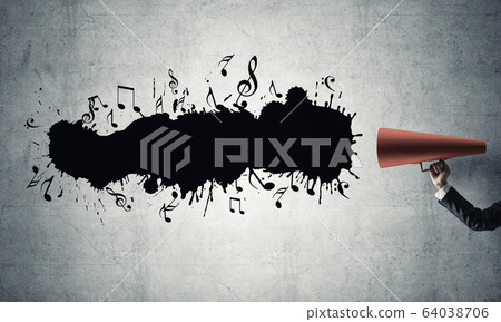 Hand of businesswoman holding red paper trumpet against concrete background Hand of businesswoman holding red paper trumpet against concrete background 64038706