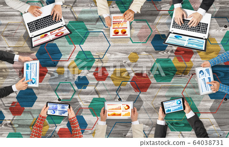 Top view of businesspeople sitting at table and using gadgets Top view of businesspeople sitting at table and using gadgets 64038731