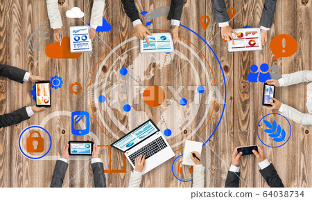 Top view of businesspeople sitting at table and using gadgets Top view of businesspeople sitting at table and using gadgets 64038734