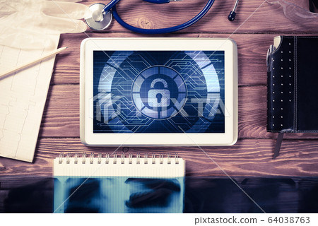 Web security and technology concept with tablet pc on wooden tab Web security and technology concept with tablet pc on wooden tab 64038763