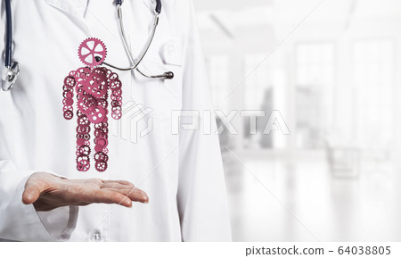 Woman doctor palm showing figure made of gear mechanism as symbo 64038805