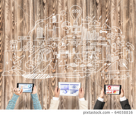 Top view of businesspeople sitting at table and using gadgets Top view of businesspeople sitting at table and using gadgets 64038816