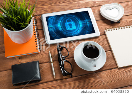 Web security and technology concept with tablet pc on wooden table 64038830