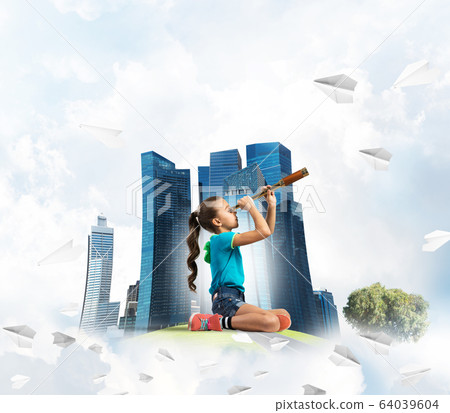Concept of careless happy childhood with girl looking in future Concept of careless happy childhood with girl looking in future 64039604