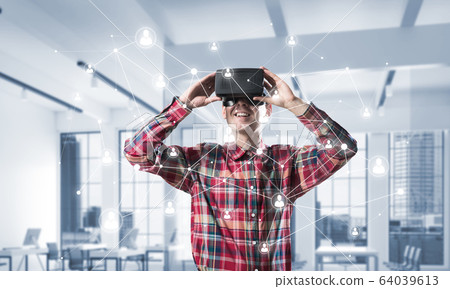 Guy wearing checked shirt and virtual mask demonstrating some emotions Guy wearing checked shirt and virtual mask demonstrating some emotions 64039613