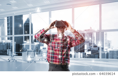 Guy wearing checked shirt and virtual mask demonstrating some emotions Guy wearing checked shirt and virtual mask demonstrating some emotions 64039614