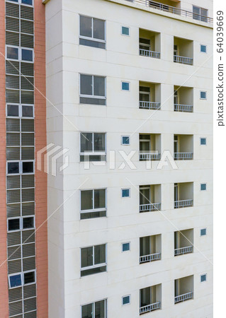 Apartment building exterior architecture with windows and balconies  64039669