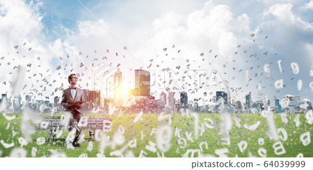 Young businessman or student studying the science and symbols fly around Young businessman or student studying the science and symbols fly around 64039999