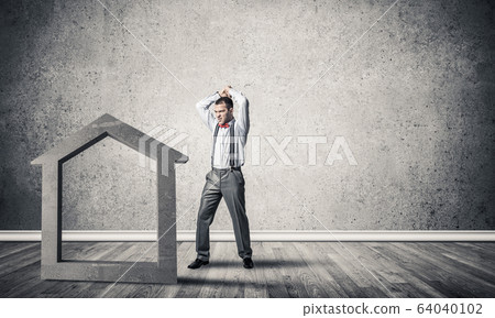 Stone home silhouette in empty room as symbol for real estate in Stone home silhouette in empty room as symbol for real estate in 64040102