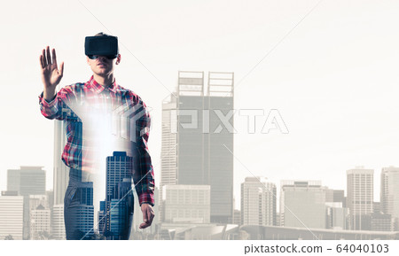 Guy wearing checked shirt and virtual mask stretching hand to to 64040103