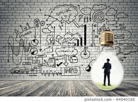 Businessman trapped in bulb Businessman trapped in bulb 64040188