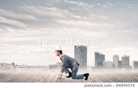 King businessman in elegant suit running and modern cityscape at 64040574