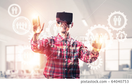 Guy wearing checked shirt and virtual mask demonstrating some em 64040753
