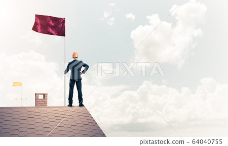Young businessman with flag presenting concept of leadership. Mi Young businessman with flag presenting concept of leadership. Mi 64040755