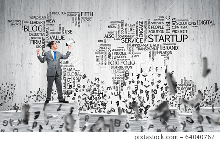 Businessman standing with megaphone. 64040762