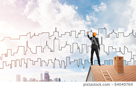 Man architect draw silhouette of modern city on blue sky. Mixed media Man architect draw silhouette of modern city on blue sky. Mixed media 64040769