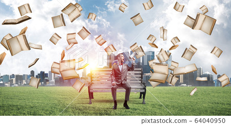 Businessman in summer park announcing something in loudspeaker and books falling from above Businessman in summer park announcing something in loudspeaker and books falling from above 64040950