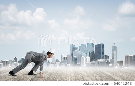 King businessman in elegant suit running and modern cityscape at background 64041248