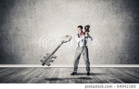 Breaking through access concept with man in room crashing concre 64042160