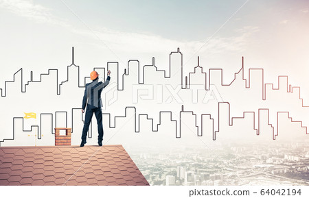 Man architect draw silhouette of modern city on blue sky. Mixed Man architect draw silhouette of modern city on blue sky. Mixed 64042194