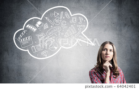 Serious woman looks pensive upwards Serious woman looks pensive upwards 64042401