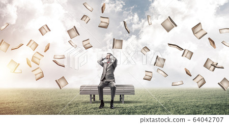 Young man in suit in park dont want to hear anything Young man in suit in park dont want to hear anything 64042707