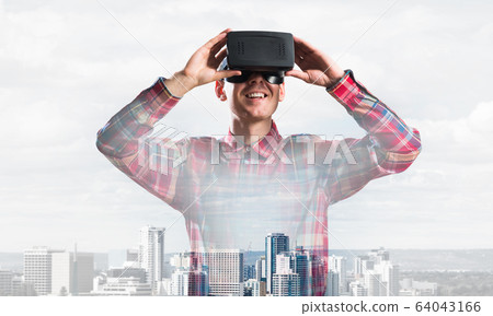 Guy wearing checked shirt and virtual mask demonstrating some emotions Guy wearing checked shirt and virtual mask demonstrating some emotions 64043166