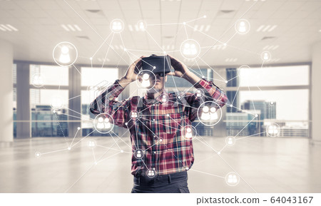 Guy wearing checked shirt and virtual mask demonstrating some em Guy wearing checked shirt and virtual mask demonstrating some em 64043167