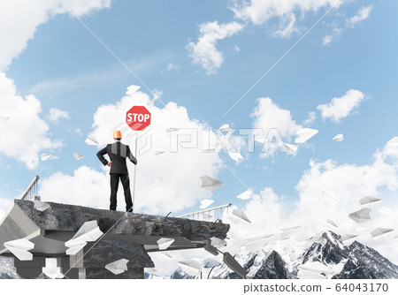 Confident engineer holding street safety sign. Confident engineer holding street safety sign. 64043170