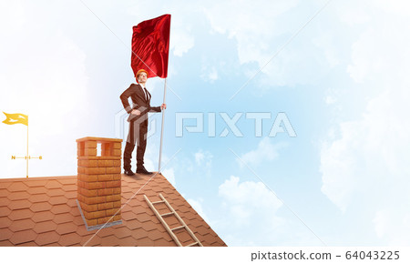 Young businessman with flag presenting concept of leadership. Mixed media 64043225