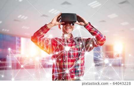 Guy wearing checked shirt and virtual mask demonstrating some emotions Guy wearing checked shirt and virtual mask demonstrating some emotions 64043228
