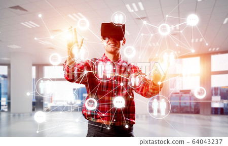 Guy wearing checked shirt and virtual mask reaching hand to touch screen Guy wearing checked shirt and virtual mask reaching hand to touch screen 64043237