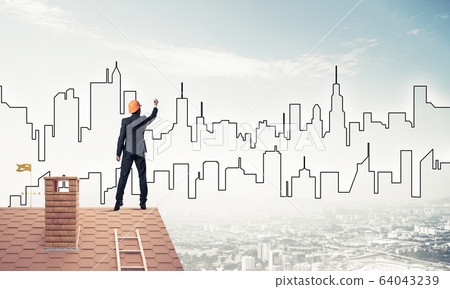 Man architect draw silhouette of modern city on blue sky. Mixed Man architect draw silhouette of modern city on blue sky. Mixed 64043239