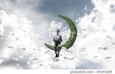 Young businessman or student studying the science and paper plan Young businessman or student studying the science and paper plan 64043884