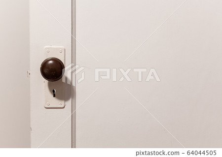 old wooden door with door knob old wooden door with door knob 64044505