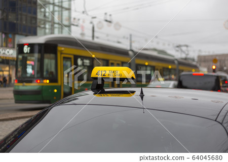Checker taxi lighted rooftop car on a blurred background Checker taxi lighted rooftop car on a blurred background 64045680