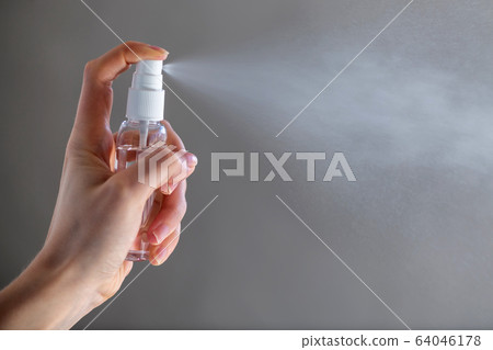 Female person woman or girl applying spray Female person woman or girl applying spray 64046178