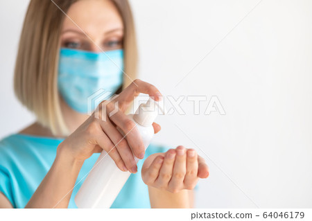 Female doctor or nurse in uniform puts a Female doctor or nurse in uniform puts a 64046179